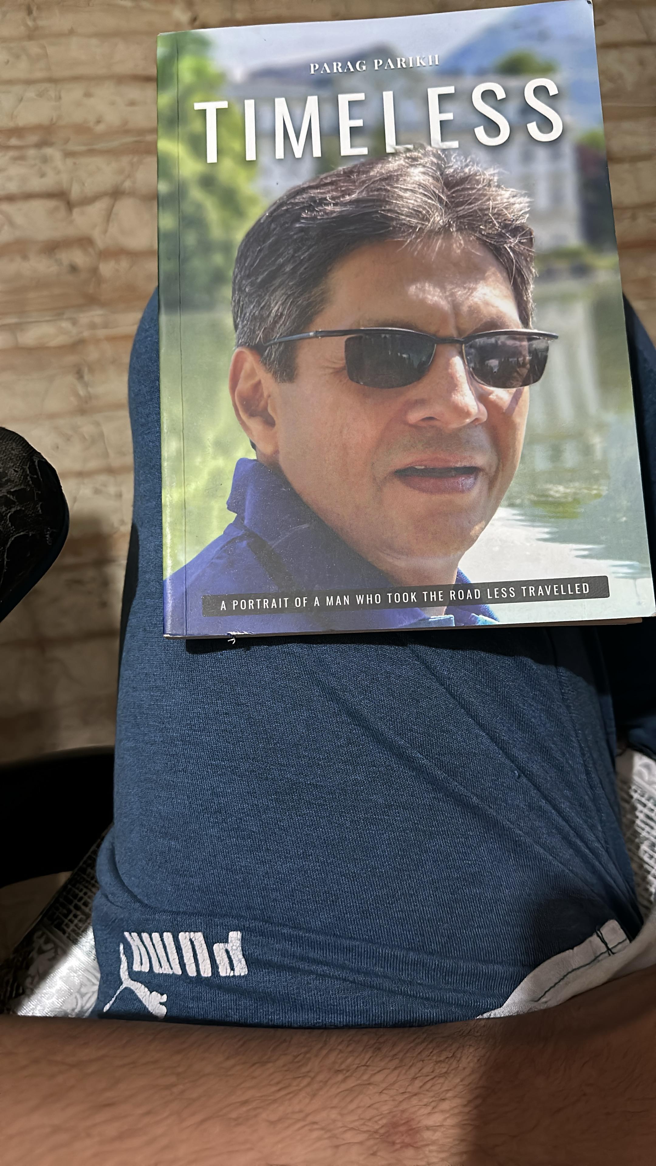 The book Timeless by Parag Parikh, resting on a lap